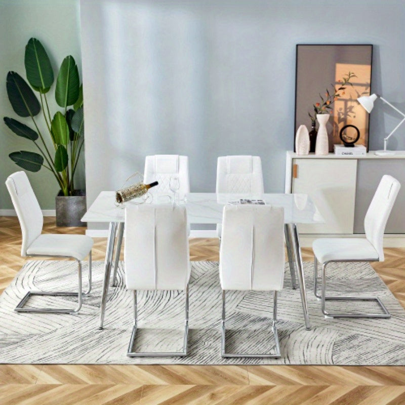 Table and chair set. 1 table and 6 white chairs. Rectangular dining table, 0.4 white imitation marble tabletop, silver metal table legs. Paired with 4 white chairs 1544 001
