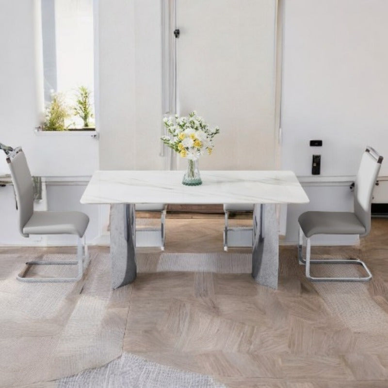 Dining Table and Chair Set. 1 Rectangular Table with White Imitation Marble Tabletop and Silver Metal Legs, Paired with 6 Black PU Chairs with Silver Legs. Model DT-1544 C-008. Stylish and Durable Furniture for Your Home.