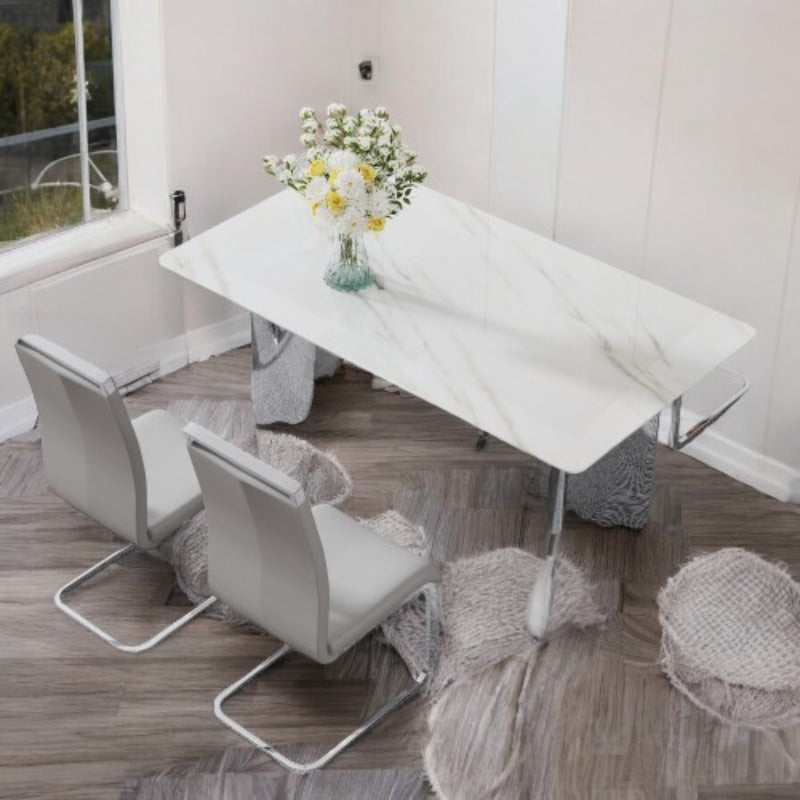 Dining Table and Chair Set. 1 Rectangular Table with White Imitation Marble Tabletop and Silver Metal Legs, Paired with 6 Black PU Chairs with Silver Legs. Model DT-1544 C-008. Stylish and Durable Furniture for Your Home.